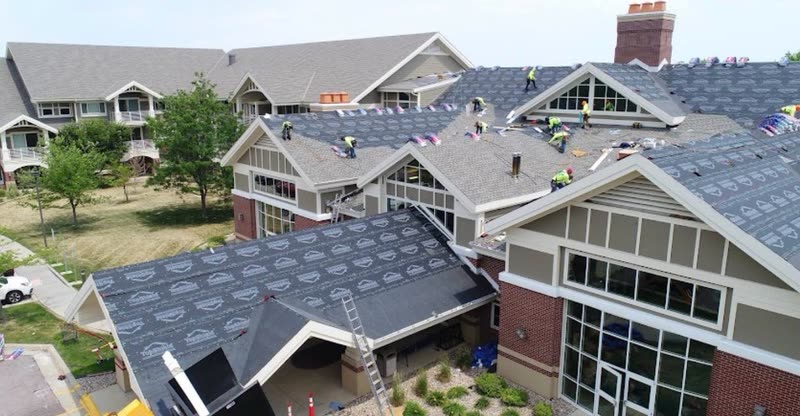 Several gabled roof sections of a senior living community dried in with synthetic underlayment
