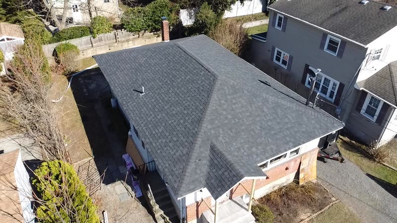 Brick ranch home with a newly finished shingle roof