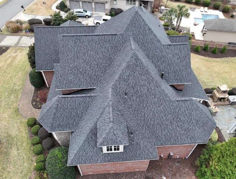 Multi-gable brick home with a newly finished architectural shingle roof